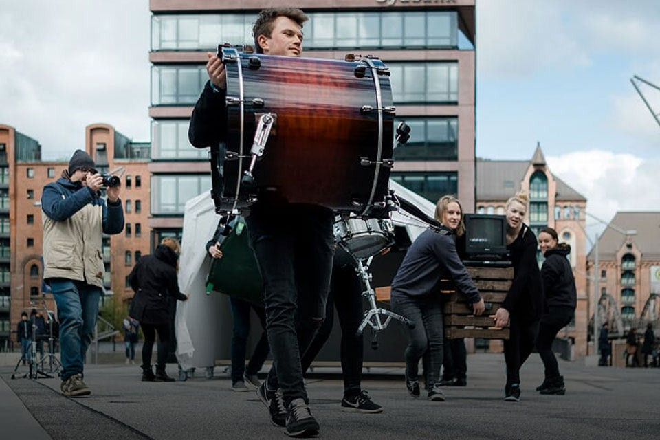 Musicians moving through a room as a walking act