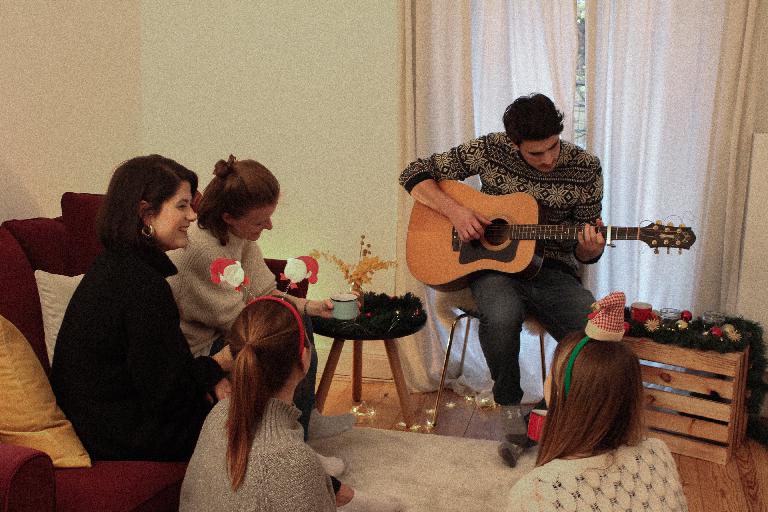 A duo playing at a company Christmas party
